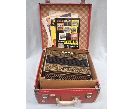 A HOHNER ACCORDION, CASED in original cardboard box