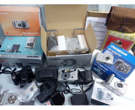 A CANON EOS D-60 DIGITAL CAMERA and a collection of cameras