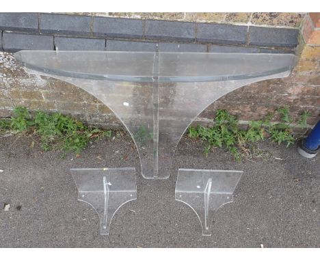 A MODERNIST PERSPEX CONSOLE TABLE with a d-shaped top, 68cm high x 124cm wide x 45cm deep, together with two similar wall-bra