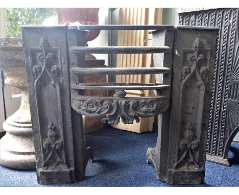 AN EARLY VICTORIAN CAST IRON HOB GRATE with 'Gothic' panels 56cm wide (no back panel)