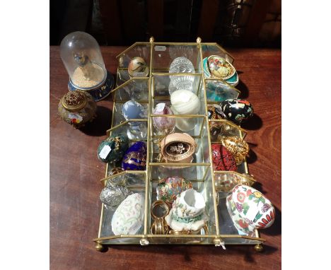 A COLLECTION OF EGGS IN VARIOUS MEDIUMS including stone, ceramic and glass