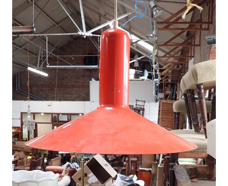 A MODERNIST LIGHT FITTING of orange painted metal 45cm diam