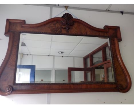 A GEORGE II STYLE WALNUT FRAMED WALL MIRROR with architectural frame and bevelled plate 118 x 77cm