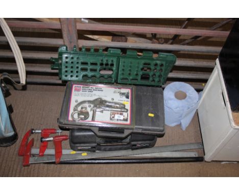 A pry bar; two clamps and various tools etc