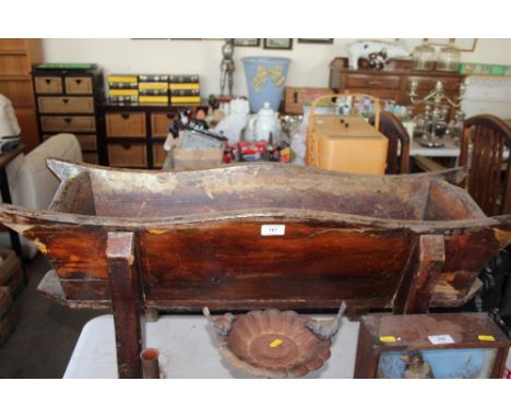 A rustic wooden trough