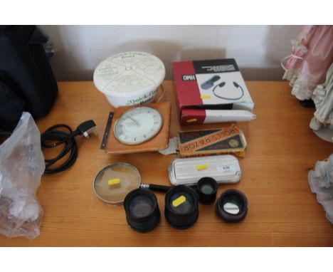 A quantity of sundries to include various camera lenses; a magnifying glass; a sound amplifier; cooking dish etc