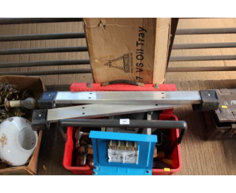 An oil tray together with a box of various tools