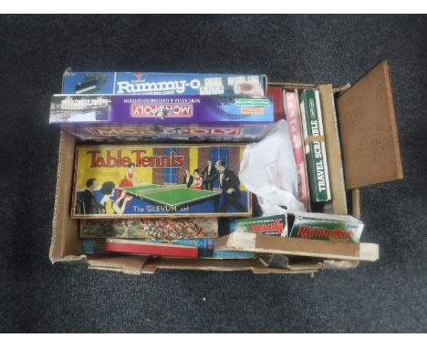 A box containing vintage and later board games including Monopoly Gateshead and Newcastle Edition, jigsaws, table tennis etc 
