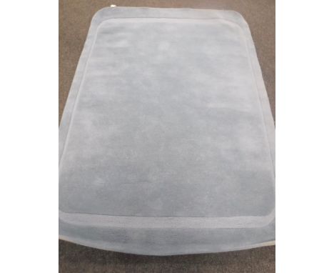 A hand knotted light blue rug, 160 cm x 230 cm