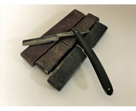 Three boxed vintage cut throat razors