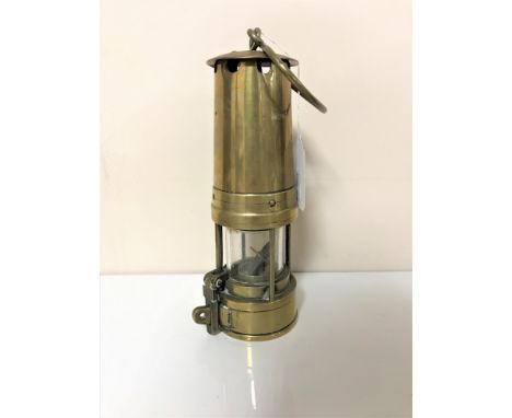 A brass miner's lamp