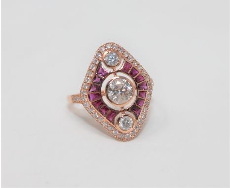 A 14ct rose gold ruby and diamond ring, featuring 1 round brilliant cut diamond 0.51ct, 2 round cut brilliant diamonds 0.18ct