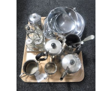 A tray of twentieth century plated wares including stainless steel, four piece tea service, tankard, cruet set on stand