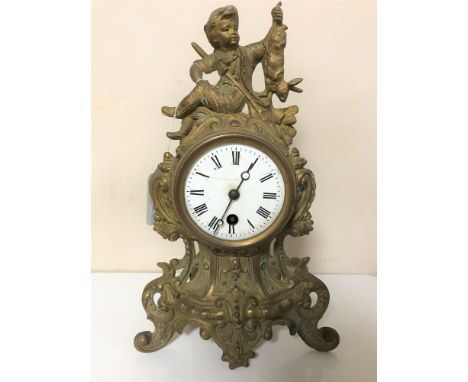 An antique gilt continental mantel clock with enamel dial 
