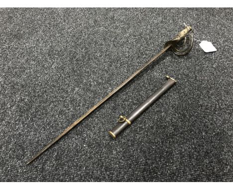 An antique brass handled short sword in part scabbard  