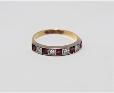 A diamond and ruby half eternity ring, the yellow metal shank indistinctly marked set with five square cut rubies and four ro