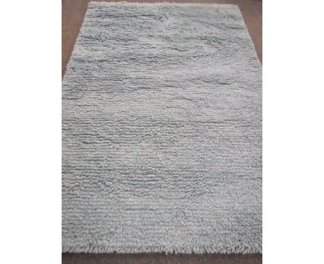 A hand knotted shaggy light blue rug, 180 cm x 270 cm