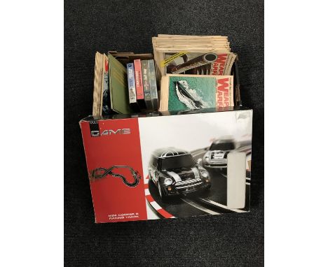 A Next mini cooper racing set together with a box containing weapons and warfare magazines, VHS tapes, The Story of the B.R.M