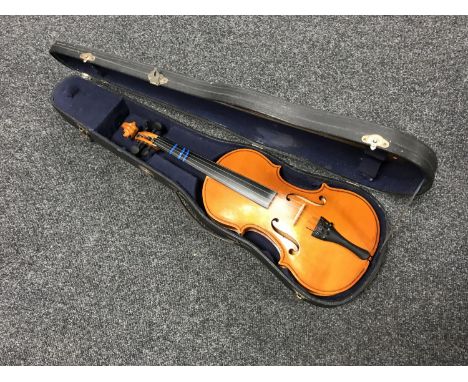 A violin and bow in hard case 