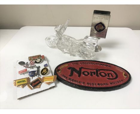 Motorcycle memorabilia to include a German glass motorcycle ornament, cast iron Norton plaque, British motor cycle and light 