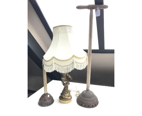 A cherub table lamp together with two vintage poss sticks 
