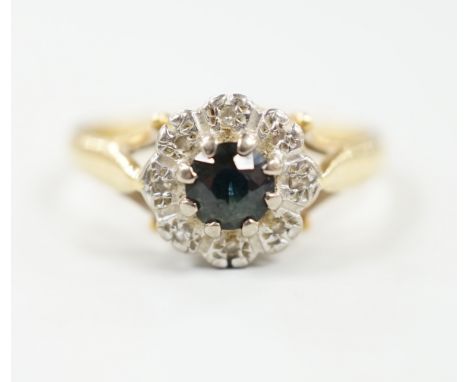 A 1960's 18ct gold, sapphire and diamond chip set cluster ring, size M, gross weight 4.9 grams.