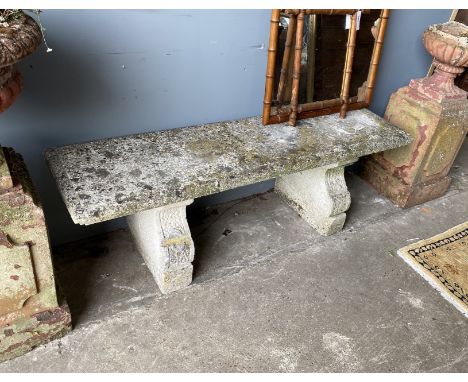 A rectangular reconstituted stone garden bench, length 144cm, width 38cm, height 47cm