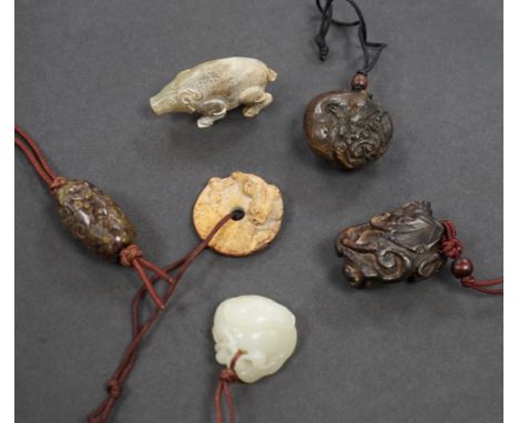 Six Chinese jade carvings, Qing dynasty and later, including a pale celadon jade carving of a duck biting lotus, 3.2 cm