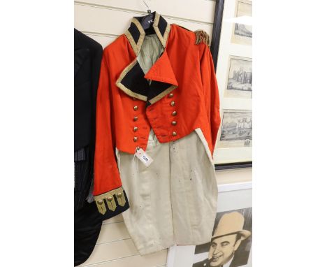 A 19th century red military jacket with gilt epaulettes, buttons and trim