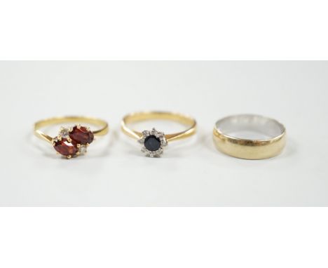 A modern 18ct gold, sapphire and diamond set cluster ring, size N/O, a similar 18ct gold, two stone garnet? and two stone dia