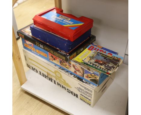 A boxed Palitoy Action Man 105mm light gun, together with two Matchbox Carry Cases containing 50+ Matchbox Superfast vehicles