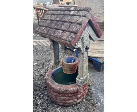 A large reconstituted stone ornamental wishing well garden planter, height 97cm
