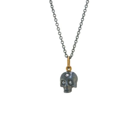A silver and 18ct gold rose-cut diamond memento mori skull pendant, with rose-cut diamond eyes, suspended from a silver chain