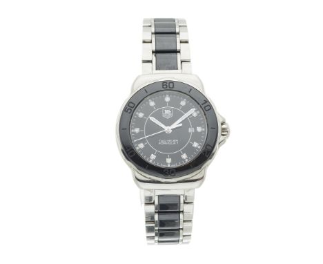 Tag Heuer, a stainless steel Formula 1 bracelet watch, ceramic bezel and factory diamond set dial, reference WAH1314, quartz 