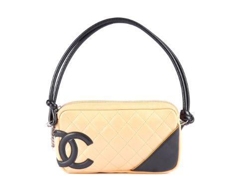 Chanel, a Ligne Cambon Pochette handbag, designed with a cream quilted leather exterior and black interlocking CC logo to one
