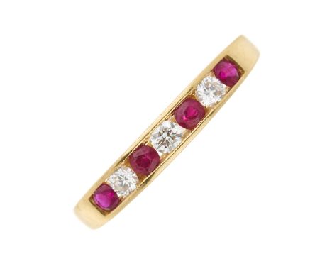 An 18ct gold circular-shape ruby and brilliant-cut diamond seven-stone ring, estimated total diamond weight 0.20ct, hallmarks