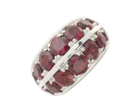 An 18ct gold graduated garnet two-row dress ring, with tapered band, approximate ring size M, 27.6gCondition- Overall good co