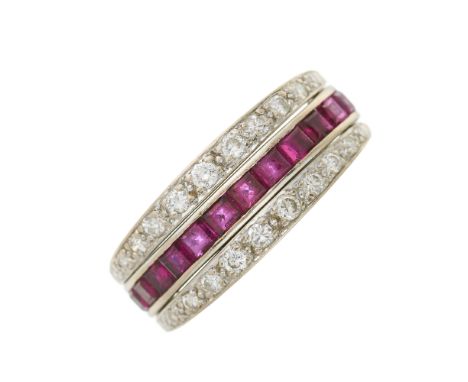 An Art Deco platinum, calibre-cut ruby and sapphire full eternity flip ring, with single-cut diamond hinged sides, estimated 