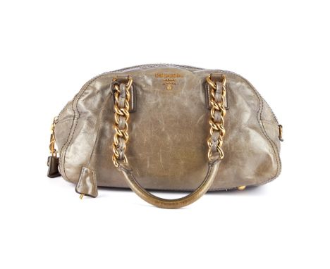 Prada, a glossy grey leather handbag, featuring gold-tone hardware, dual chain and leather shoulder straps, top zip fastening