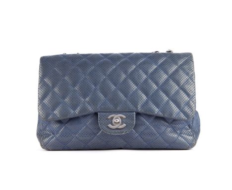 Chanel, a perforated Jumbo Classic Flap handbag, designed with a diamond quilted blue leather exterior, with perforated detai