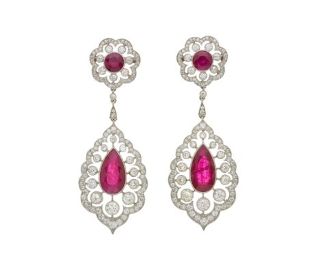 An impressive pair of pear-shape ruby and circular-cut diamond openwork drop earrings, with circular-shape ruby and diamond f