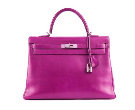 Hermes, a 2010 Kelly 35 handbag, crafted from purple box calf leather with polished silver-tone hardware, featuring a single 