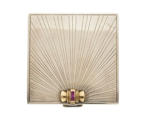 Tiffany & Co., a 1940s silver and 14ct gold powder compact, with calibre-cut ruby highlight and engraved exterior, opening to