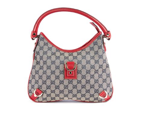 Gucci, an Abbey hobo handbag, featuring maker's beige and blue monogram canvas exterior with red leather trim, single rolled 