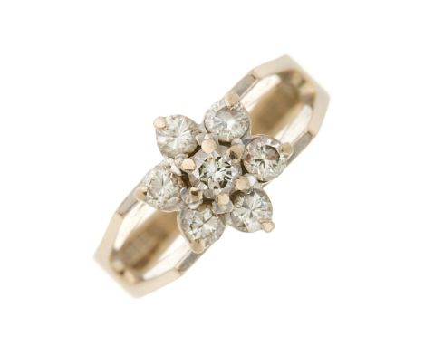 A 1970s 18ct gold brilliant-cut diamond floral cluster ring, with openwork shoulders and tapered band, estimated total diamon