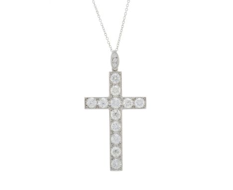An 18ct gold brilliant-cut diamond cross pendant, with similarly-cut diamond surmount, suspended from a trace-link chain, est