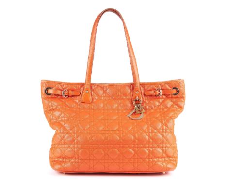 Christian Dior, a Cannage tote, crafted from cannage quilted orange coated canvas with orange leather trim, featuring gold-to