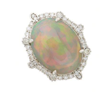 An 18ct gold opal cabochon and brilliant-cut diamond cluster dress ring, with similarly-cut diamond line shoulders, opal weig