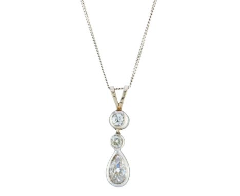 An early 20th century pear-shape diamond drop pendant, with old-cut diamond spacer and surmount, suspended from a later 9ct g