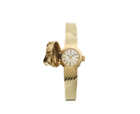 Omega, a 14ct gold bracelet watch, hinged cover opening to reveal a silvered dial, signed manual wind movement calibre 650, s